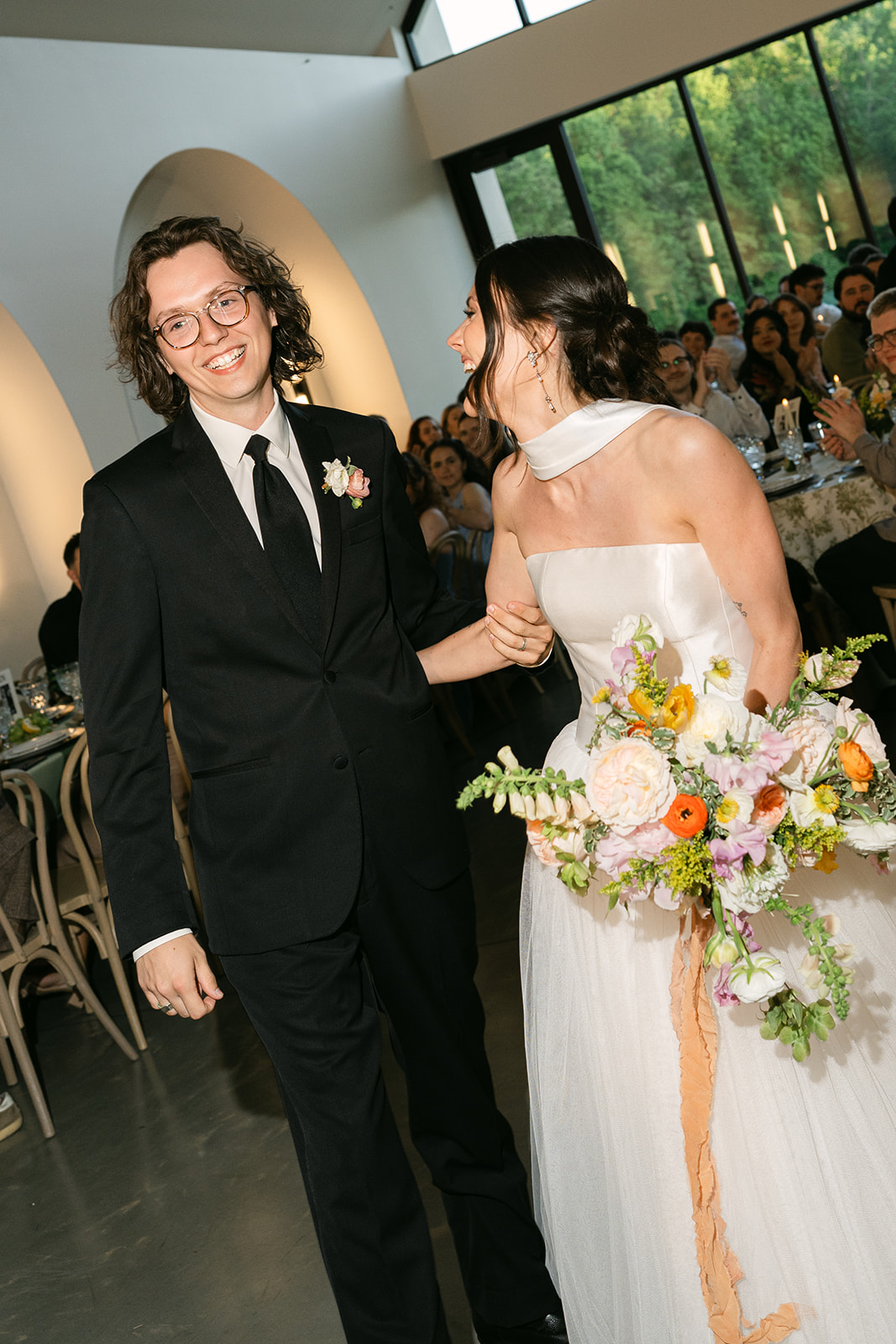 A bride and groom at their reception at The Lumen House.
