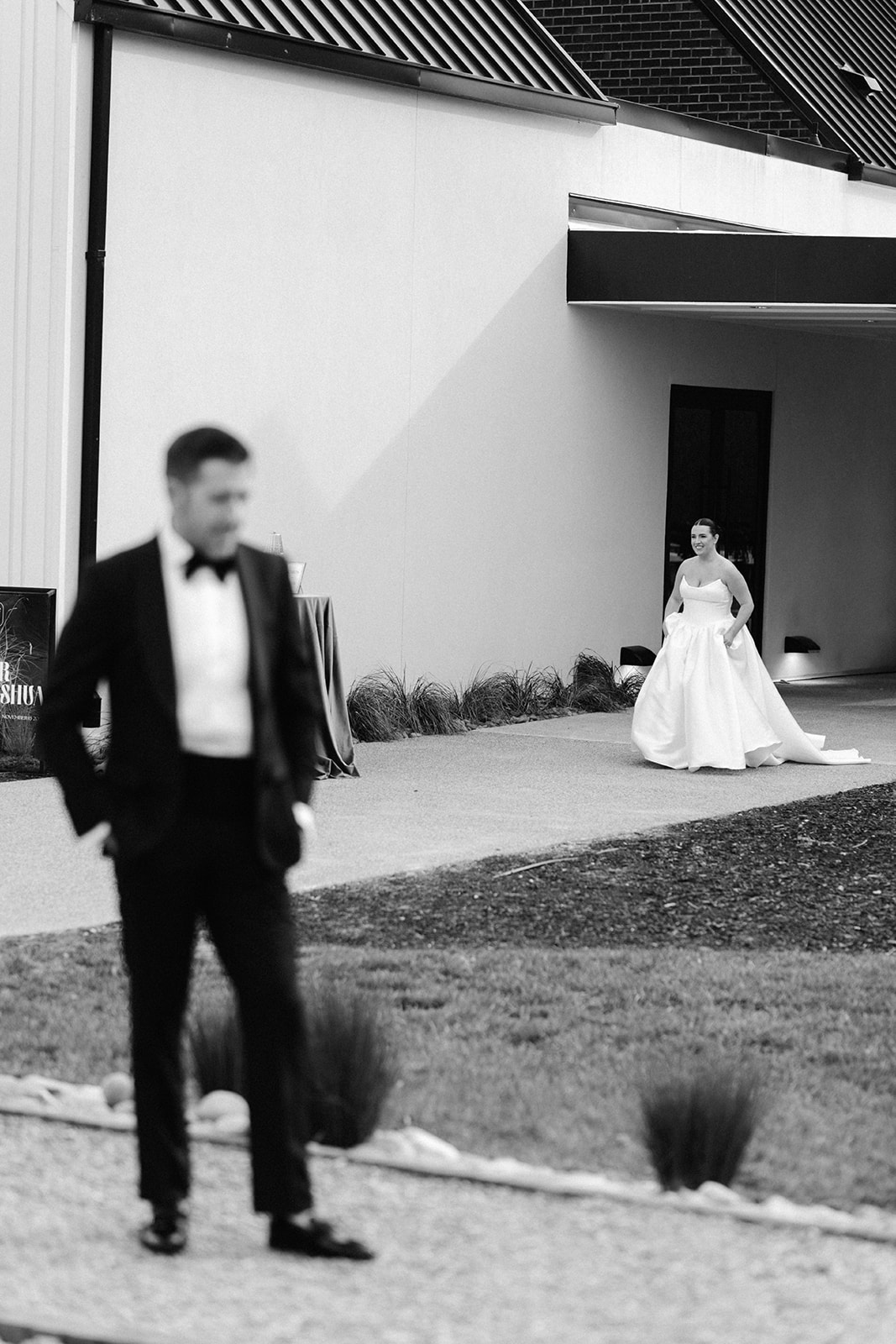 A bride and groom prepare for their first look at The Lumen House.