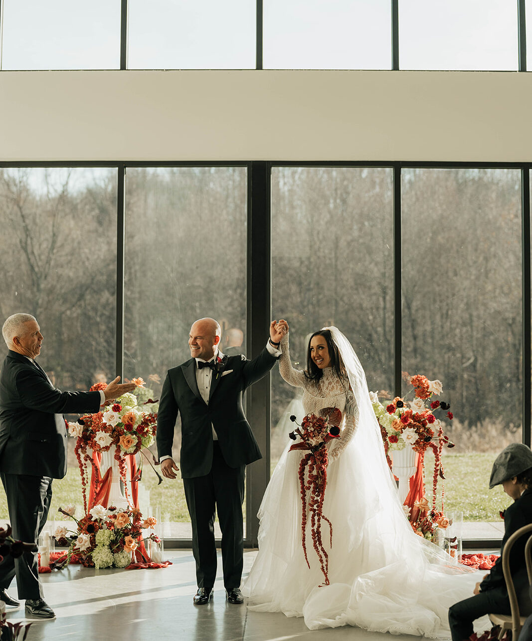 Bride and groom celebrating back down the aisle after saying 'I do'.